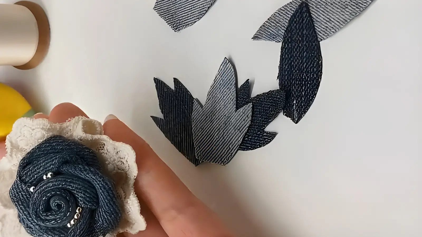 Step-6-Draw-the-leaves-on-the-denim-fabric-and-cut-them-out-then-fix-them-to-the-finished-rose